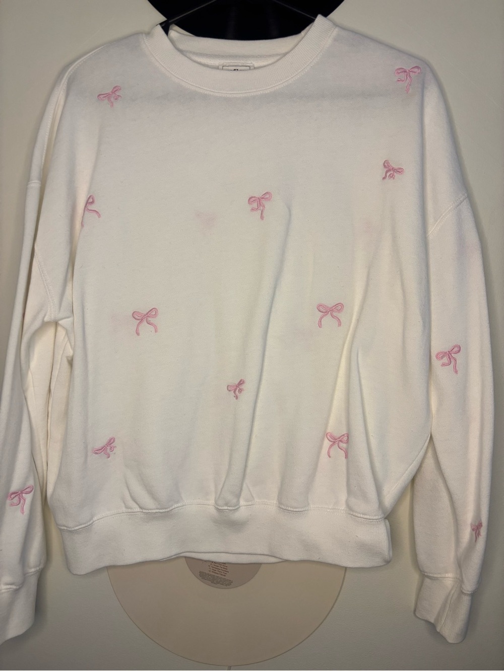Reflex White Crewneck Sweater with Pink Bow Accents